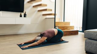 A woman performing the child's pose