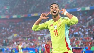 Spain's Ferran Torres points to his ears as he celebrates his goal against Albania at Euro 2024.