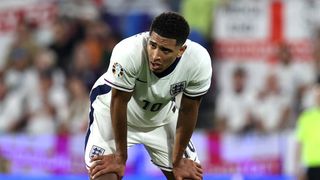 England's Jude Bellingham stands with his hand on his knees during his team's Euro 2024 match against Slovenia.