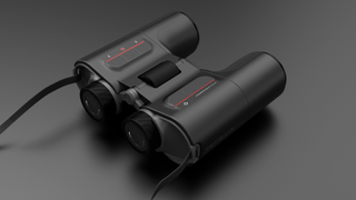 Unistellar Envision smart AR binoculars on a gray studio background